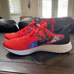 Women’s Nike Legend React; Team orange/black and white